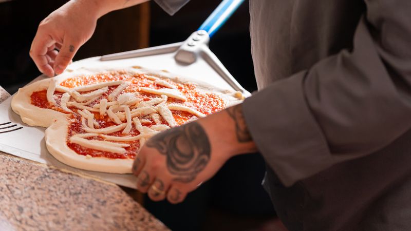 Punch pizza wood-fired oven crafting authentic Neapolitan pizza